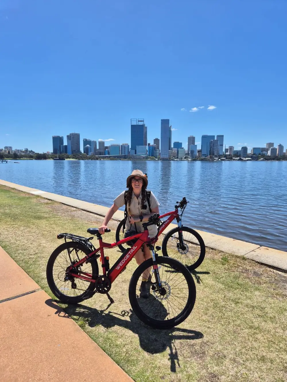 Laura the Explorer guiding a small group e-bike tour through Perth