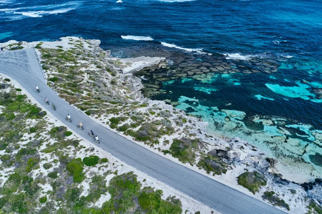 Turquoise bay and coast road on Rottnest Island seen from above